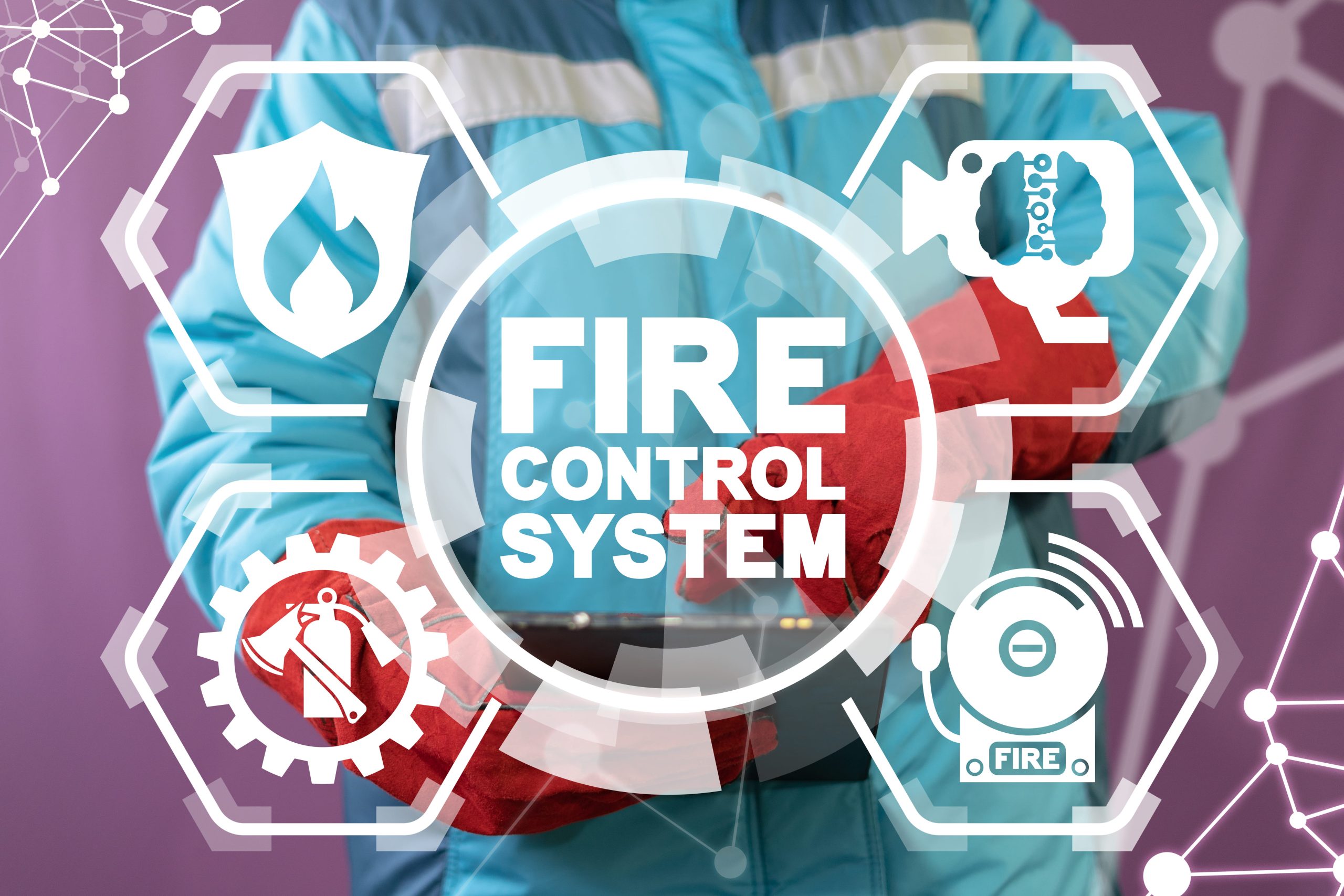 elementy nowoczesnego systemu przeciwpożarowego na tle strażaka